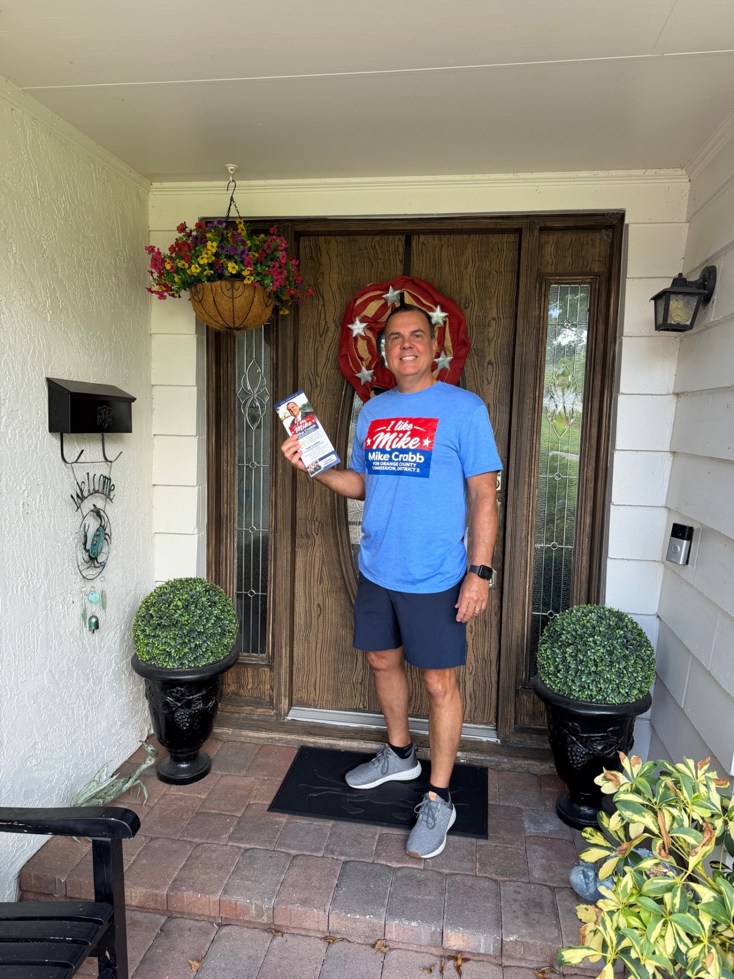 Mike Crabb canvassing at a neighbor's front door
